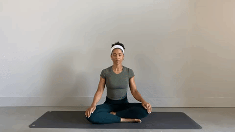 Alexa Idama practicing Pilates spinal circles