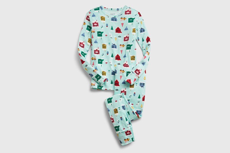A pair of matching family Christmas pajamas in a holiday-themed print.