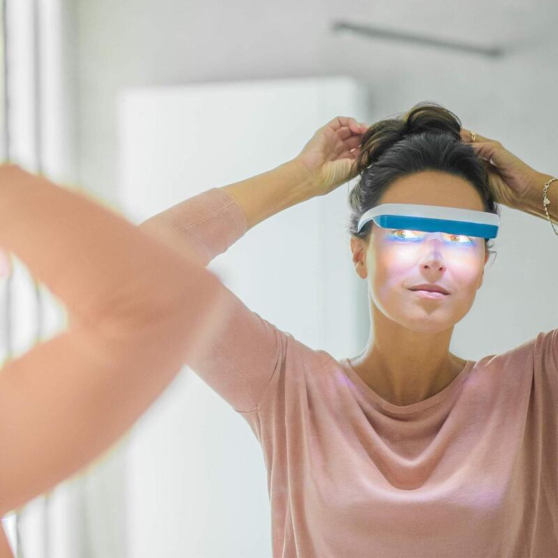 Woman wearing Luminette light-therapy glasses