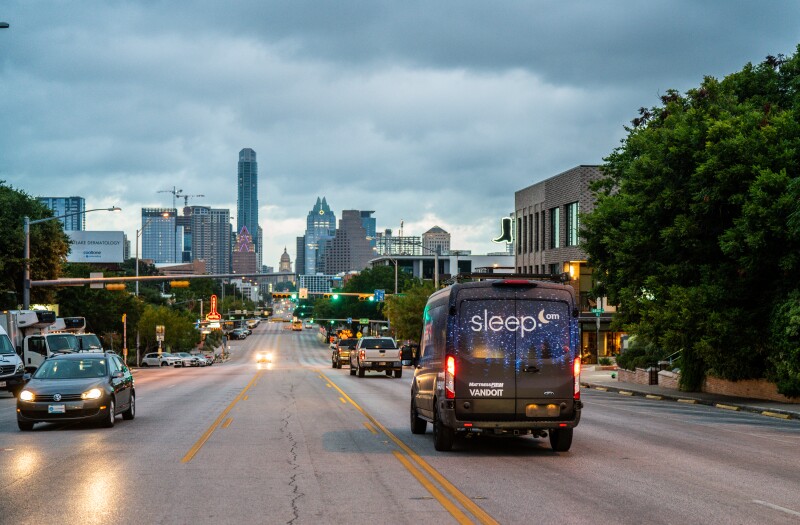 Sleep.com van drives into Austin, Texas.