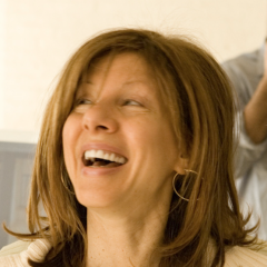 Writer Janet Ungless. She is looking up and to her right and appears to be mid-laugh.