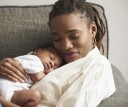 Mother holding her baby for a nap