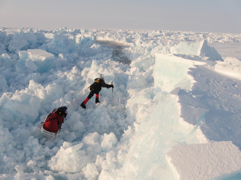 Annie hiking the icy tundra of the North Pole.