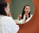 Woman applying beauty sleep cream.