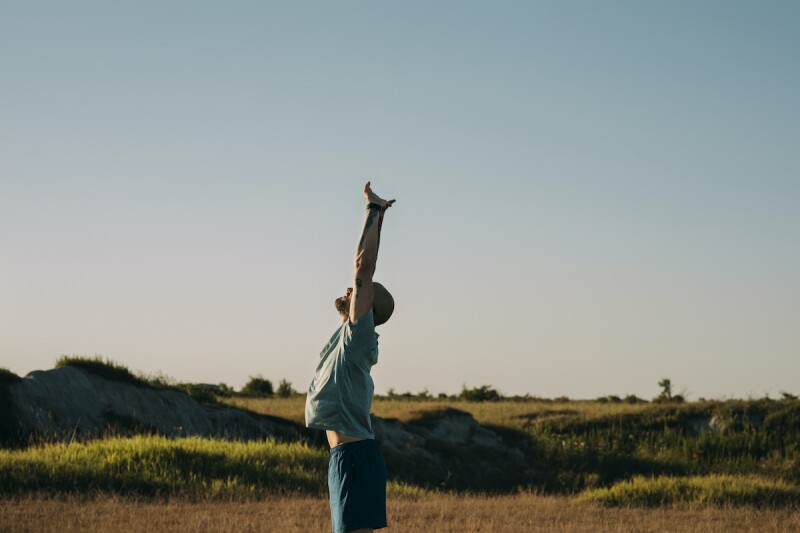 Man in sportswear stretching before a run in nature