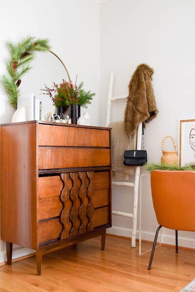 Decorative dresser with mirror and pine elements to celebrate the holiday season