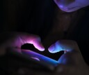 Close up of woman using her phone at night